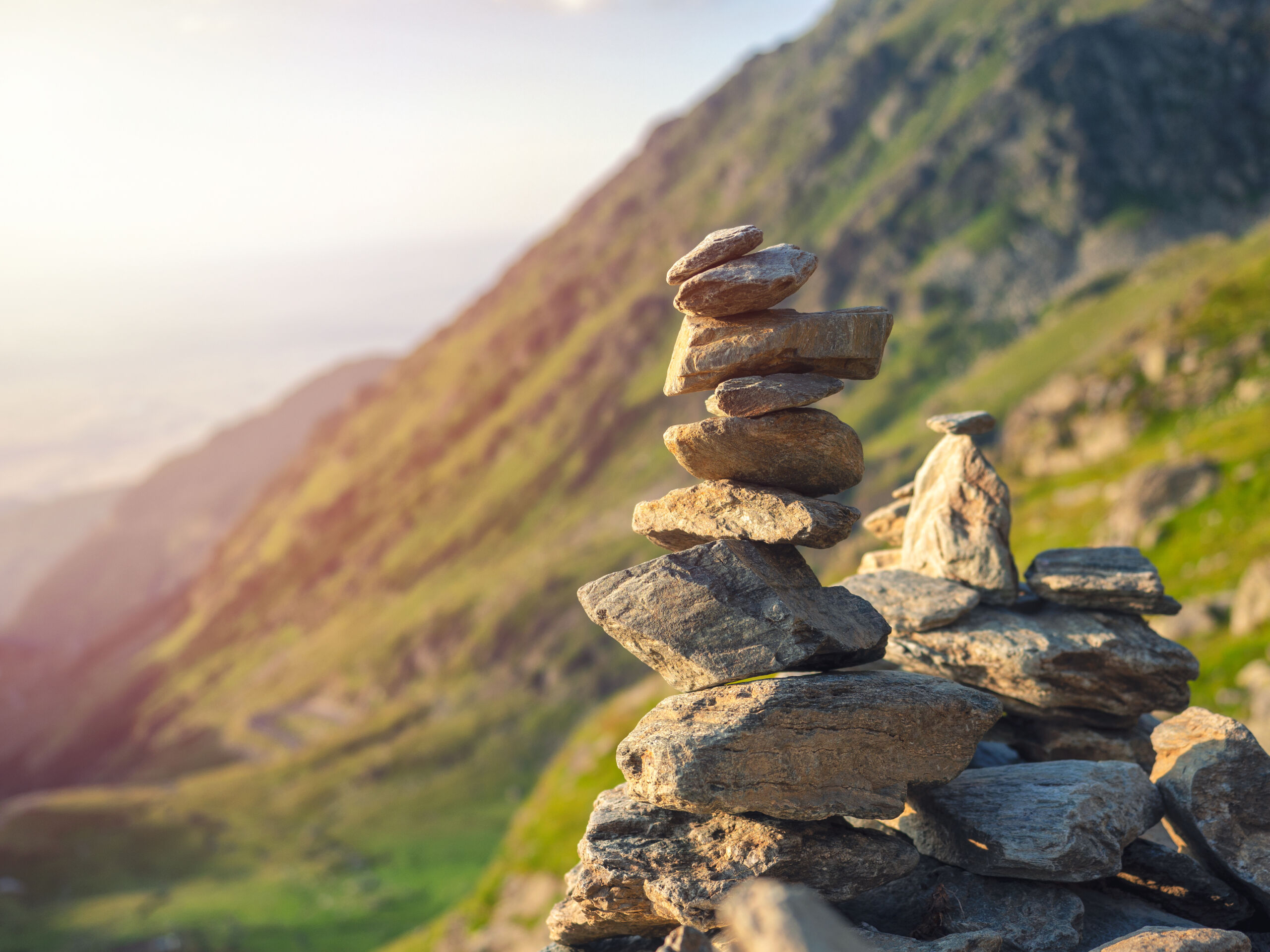 Stone stack on blurred mountain background