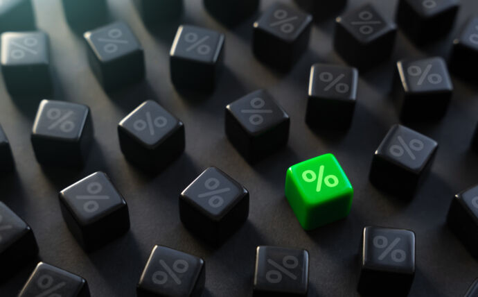 A green cube with a percentage marked among black cubes with the same mark